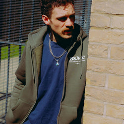 model wearing green Bike Shed Motorcycle Co. Good Times Hooded Sweatshirt