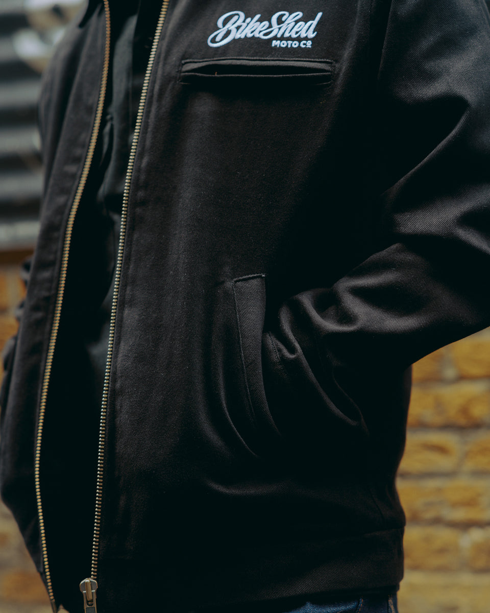 model wearing the black twill motorcycle jacket - pocket detail