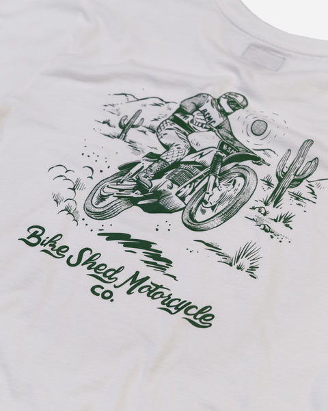 White t-shirt with green motorcycle graphic and 'Bike Shed Motorcycle Co.' text logo on a white background
