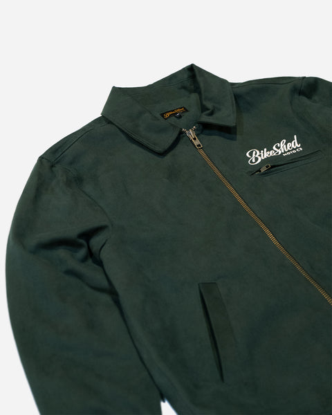 Green motorcycle jacket with a Bike Shed Moto Co brand logo on a white background